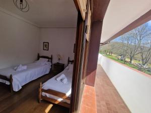Postel nebo postele na pokoji v ubytování Hostal Lizuniaga