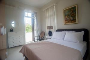 Ένα ή περισσότερα κρεβάτια σε δωμάτιο στο Tatiana's Garden House