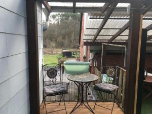 a patio with a table and chairs on a porch at CASA Palatina in Merzalben