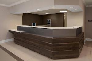 a lobby with a reception desk in a building at Residence Inn Dallas DFW Airport North/Irving in Irving +21 photos