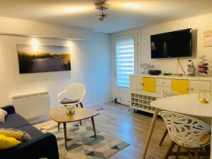 Televízia a/alebo spoločenská miestnosť v ubytovaní Appart cocooning avec parking gratuit & wifi