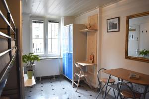 a room with a table and chairs and a window at Hostel 24 in Ljubljana