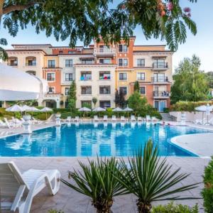 a large swimming pool in front of a building at Lily Beach - Apartment 408A in Sozopol