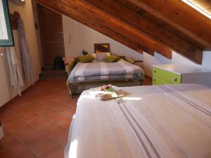 Letto o letti in una camera di Casa Mercurio