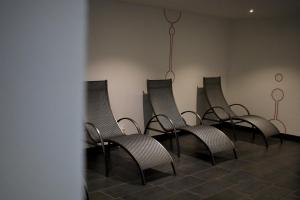 a row of chairs lined up in a room at Sporthotel Zederhaus im Lungau in Zederhaus +34 photos