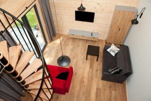 an overhead view of a living room with a red couch at Kapitanka Apartamenty in Okuninka +13 photos
