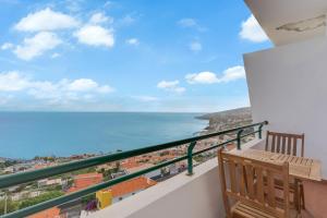 a balcony with a view of the ocean at Santa Cruz Apartment with Sea View by HR Madeira in Santa Cruz