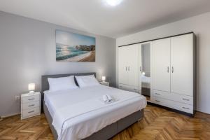 Postel nebo postele na pokoji v ubytování Apartman Bella Vita
