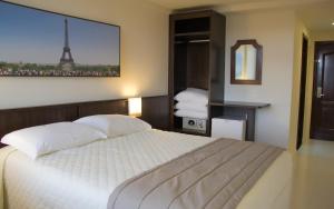 Cama ou camas em um quarto em Bogari Hotel