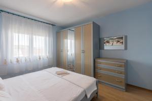 Posteľ alebo postele v izbe v ubytovaní Apartman Bella Vita