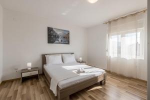 Postel nebo postele na pokoji v ubytování Apartman Bella Vita