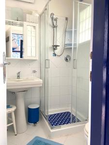 a bathroom with a shower and a sink at Pino Marino in San Felice Circeo