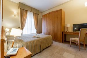 Postel nebo postele na pokoji v ubytování Hotel Relax