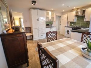 a kitchen with a table and a dining room at 28 Waterloo in Chester