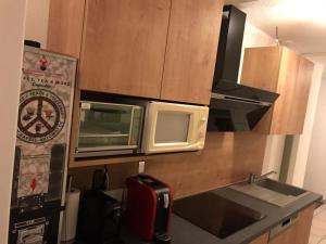 a kitchen with two microwaves and a microwave at Privatzimmer Weber in Hautzenbichl