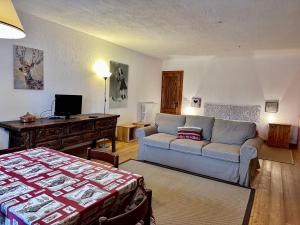 a living room with a couch and a table at La Baita di BessenHaut 