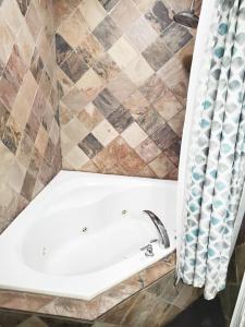 a bathroom with a sink and a shower curtain at Executive-BBQ-Full-Kitchen-Washer-Dryer-Sauna-Backyard-Parking-Air-Conditioning in Blue Mountains +25 photos