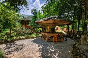 a gazebo in the middle of a garden at Sapa Riverside Homestay in Sa Pa