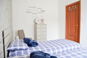 Posteľ alebo postele v izbe v ubytovaní Appartamento Ciclamino