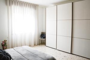 Posteľ alebo postele v izbe v ubytovaní Appartamento Ciclamino