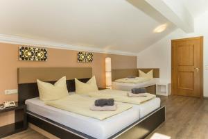 Letto o letti in una camera di T3 Gasthof Spullersee