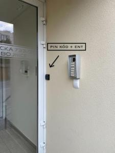 a phone on the side of a wall in a building at Apartmán Dominika Bojnice in Bojnice