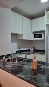 a kitchen with a sink and a counter top at Lindo ambiente de Calidad ! in Rosario
