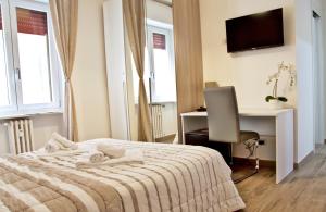 Postel nebo postele na pokoji v ubytování Minerva Rooms