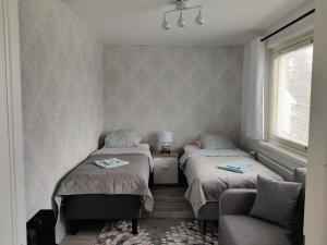 Postel nebo postele na pokoji v ubytování M Apartments Lamminpää