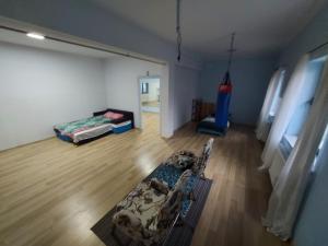 a room with a room with a bed and a room with a room at Galeria Kolorów - Apartament with a garden in Łódź