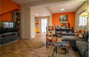 a living room with a couch and a table at Beautiful Home In Torre De Benagalbón in Torre de Benagalbón