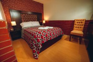 מיטה או מיטות בחדר ב-Gran Hotel París