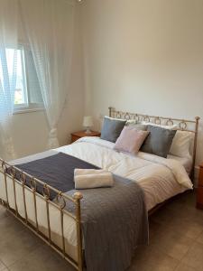 מיטה או מיטות בחדר ב-Séjour en Galillé
