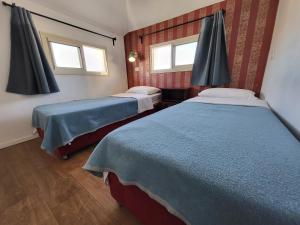 Postel nebo postele na pokoji v ubytování Haifa Hostel
