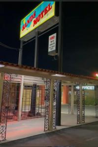 a fast food restaurant with a sign on top of it at Sands Motel in El Paso