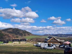 a group of cars parked in a parking lot at Chata Štíty in Štíty