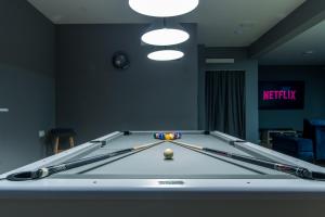 a pool table with a cue ball in a room at Villa Violet with Salt water pool in Makarska