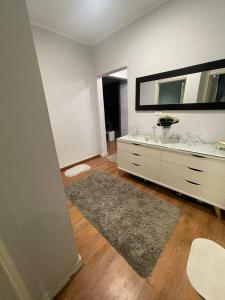 a bathroom with two sinks and a large mirror at Apartment for rent in Ramo 6 October in 6th Of October