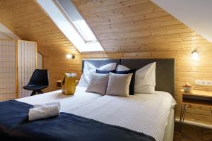En eller flere senge i et værelse på Nagypince Borhotel Wine and Spa