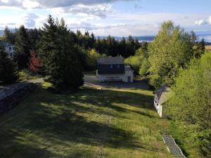 an aerial view of a house in the middle of a yard at By the Bay Lavender Villa in Chemainus