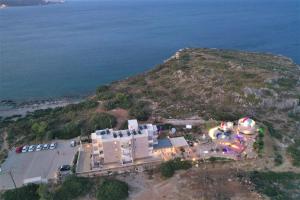 an aerial view of a resort near the ocean at Astronomy Studios in Faliraki