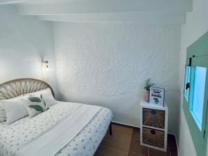 Postel nebo postele na pokoji v ubytování Casita Menta - Alojamiento único en el Centro de Torrox