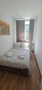 a bedroom with a large bed and a window at S.Soares Beato 6.2D in Lisbon