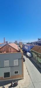 a view of a street with buildings and a train at S.Soares Beato 6.2D in Lisbon