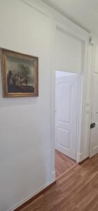 a room with a painting on the wall and a door at S.Soares Beato 6.2D in Lisbon