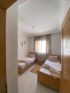 Posteľ alebo postele v izbe v ubytovaní Magnifique Appartement Vue Mer