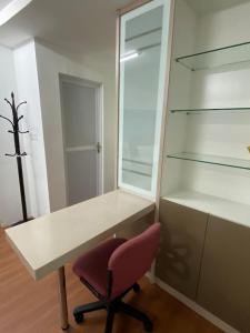 a white desk with a red chair in a room at 4 PAX ONE BEDROOM near USM SPICE ARENA AIRPORT MUTIARA SPECIALIST in Bayan Lepas