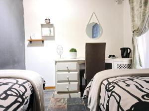 Postel nebo postele na pokoji v ubytování Horison Meyer Guest Suites
