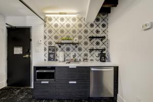 a kitchen with a black and white wallpaper at The Westlake in Toronto