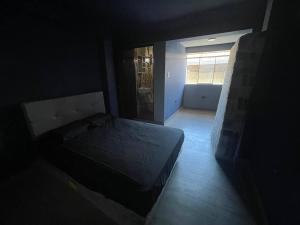 Кровать или кровати в номере Departamento en Huánuco